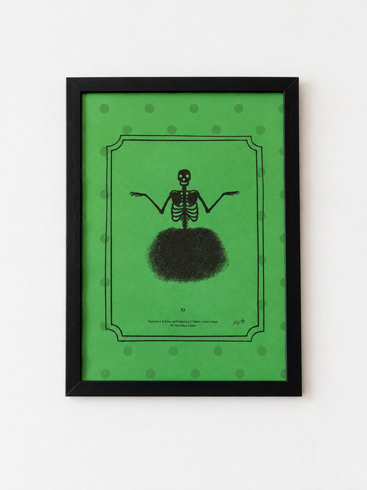 A framed art print featuring a black skeleton figure with outstretched arms on a bright green background with subtle green polka dots, enclosed in a black frame against a white wall.